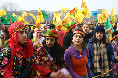 group of people in traditional Kurd attire